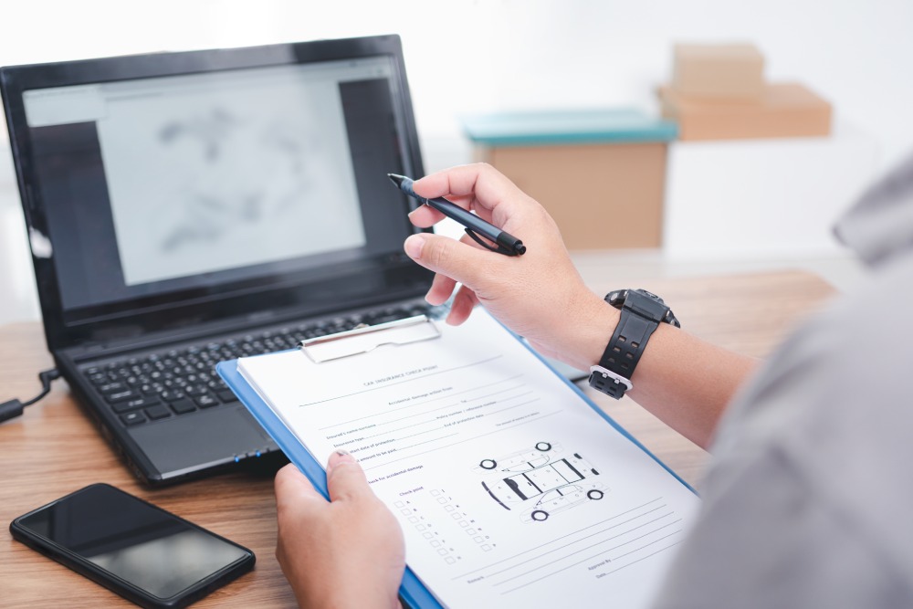 Legal insurance team completing accident report in Phoenix after a car accident